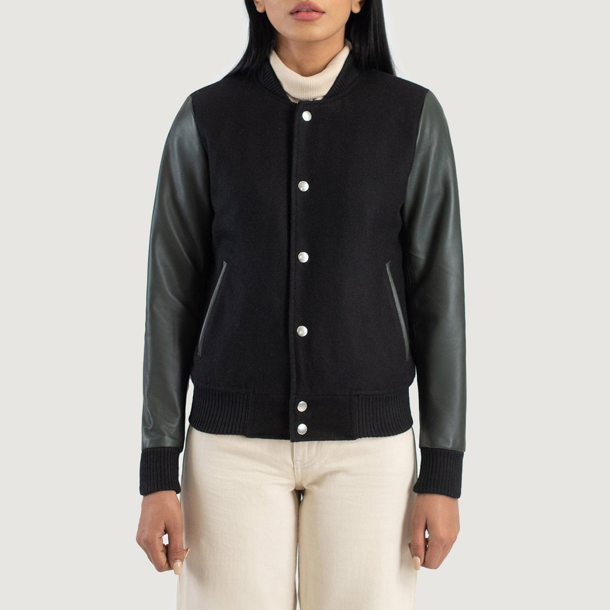 
Крупный план деталей of Varsity & Snap Buttons Hardware on Savant Green Hybrid Varsity Jacket